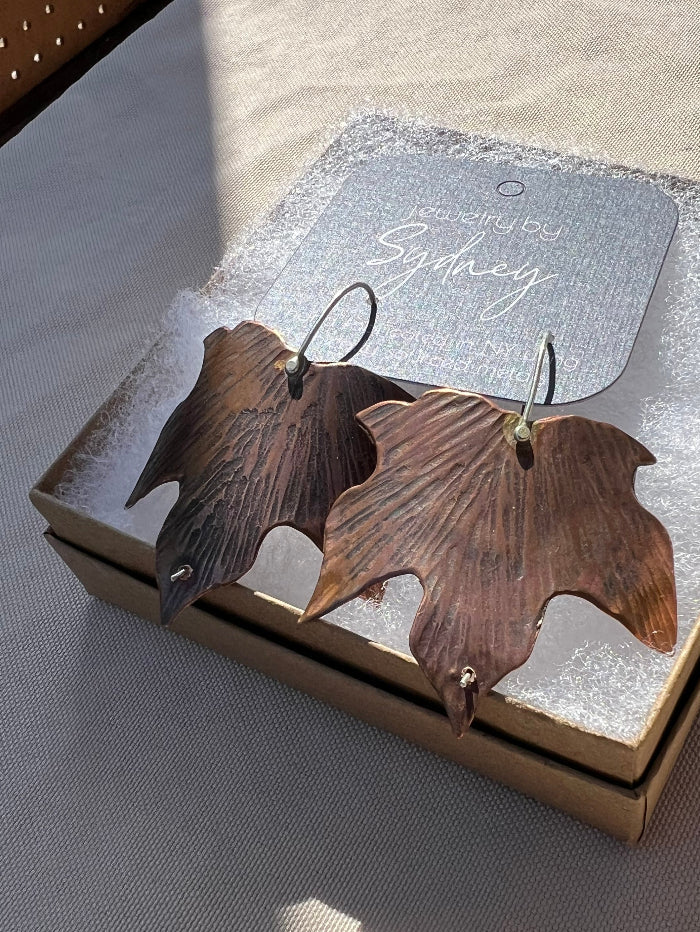 Maple Copper Earrings in a gift box in the sunshine